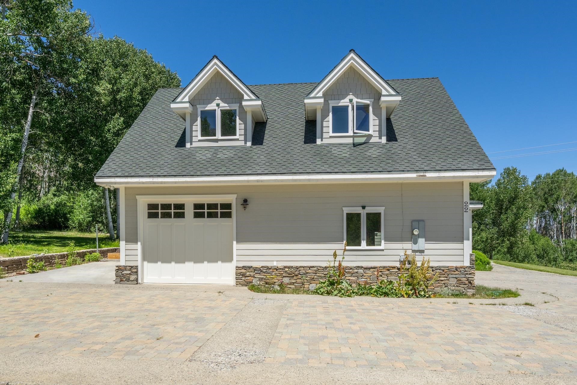 22 Juniper Drive, Unit 2 Mammoth Lakes, CA 93546 - Photo 44 of 50 front view of a house with a yard