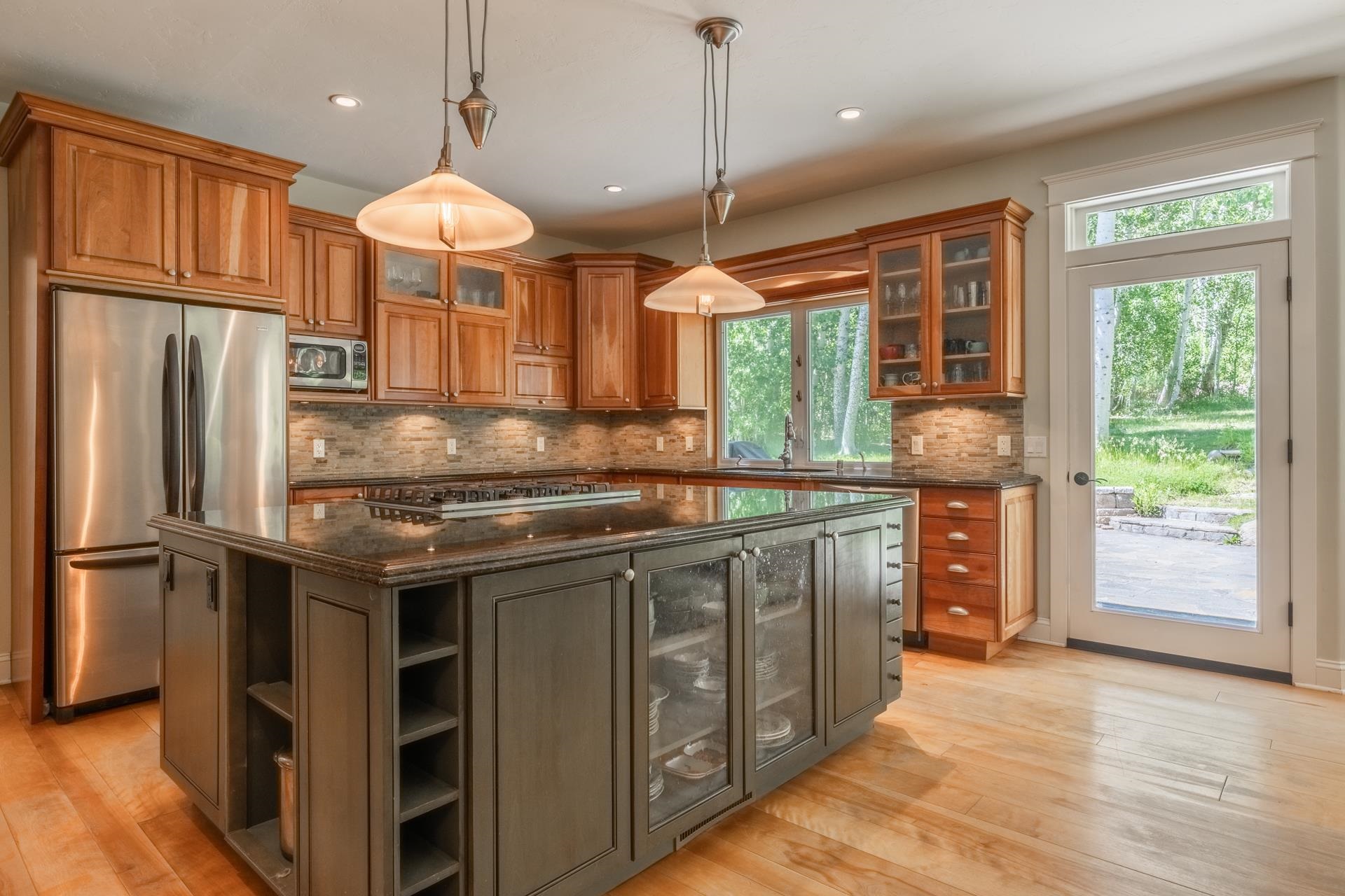 22 Juniper Drive, Unit 2 Mammoth Lakes, CA 93546 - Photo 6 of 50 a kitchen with stainless steel appliances granite countertop a sink a stove and a refrigerator