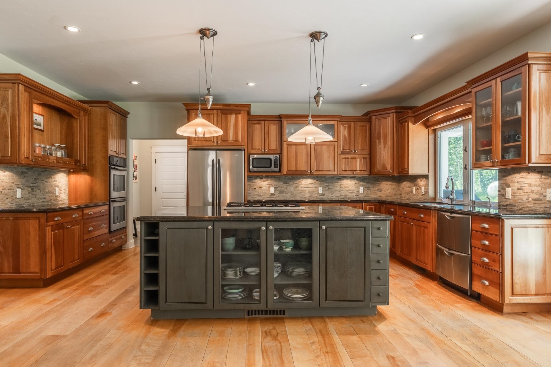 22 Juniper Drive, Unit 2 Mammoth Lakes, CA 93546 - Photo 7 of 50 a kitchen with stainless steel appliances granite countertop wooden cabinets stove and sink