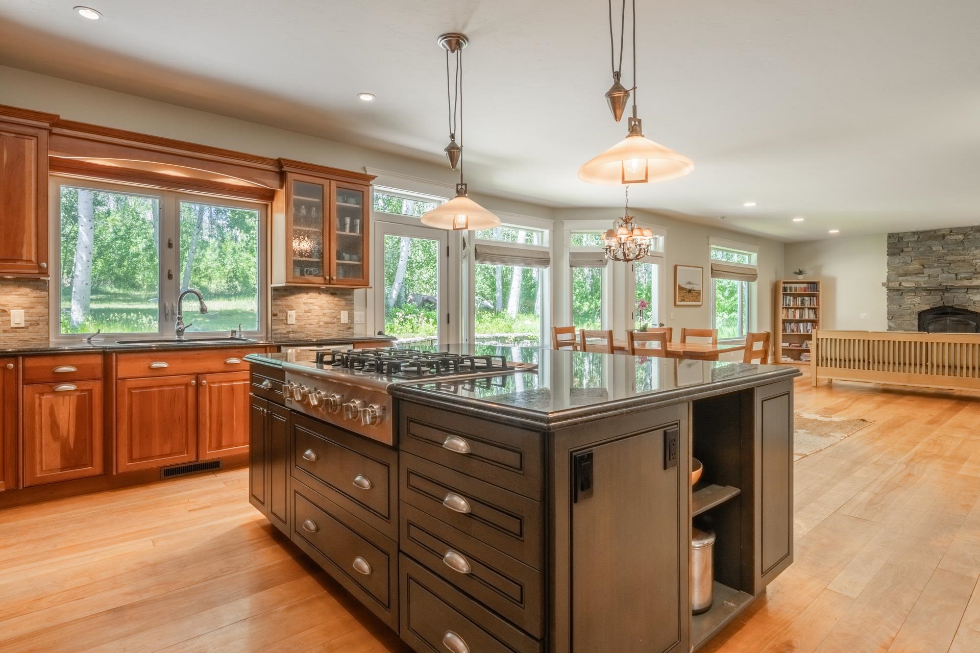 22 Juniper Drive, Unit 2 Mammoth Lakes, CA 93546 - Photo 8 of 50 a kitchen with stainless steel appliances granite countertop a stove a refrigerator and a wooden cabinets