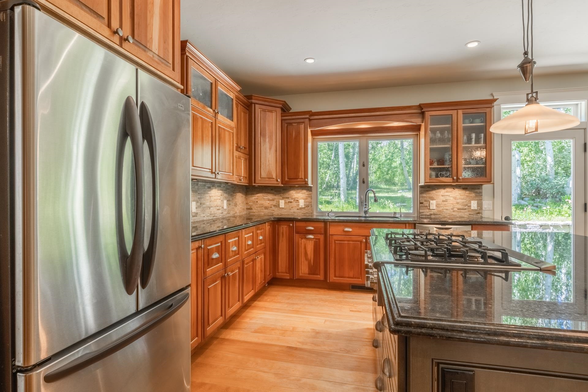 22 Juniper Drive, Unit 2 Mammoth Lakes, CA 93546 - Photo 9 of 50 a kitchen with stainless steel appliances granite countertop a refrigerator and a sink