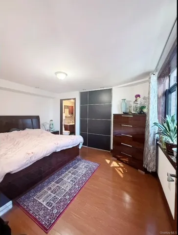 a bed room with a bed and a television