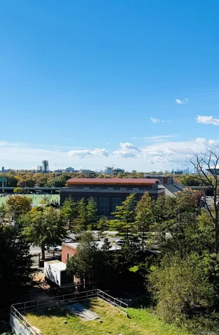 a view of a city with lawn chairs
