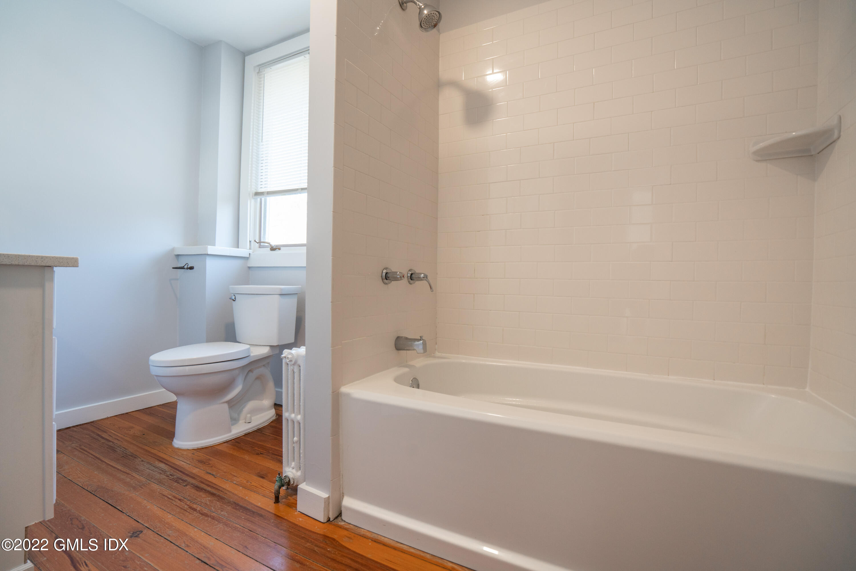 48 Sinawoy Road Cos Cob, CT 06807 - Photo 16 of 25 a bathroom with a toilet a sink and a bathtub