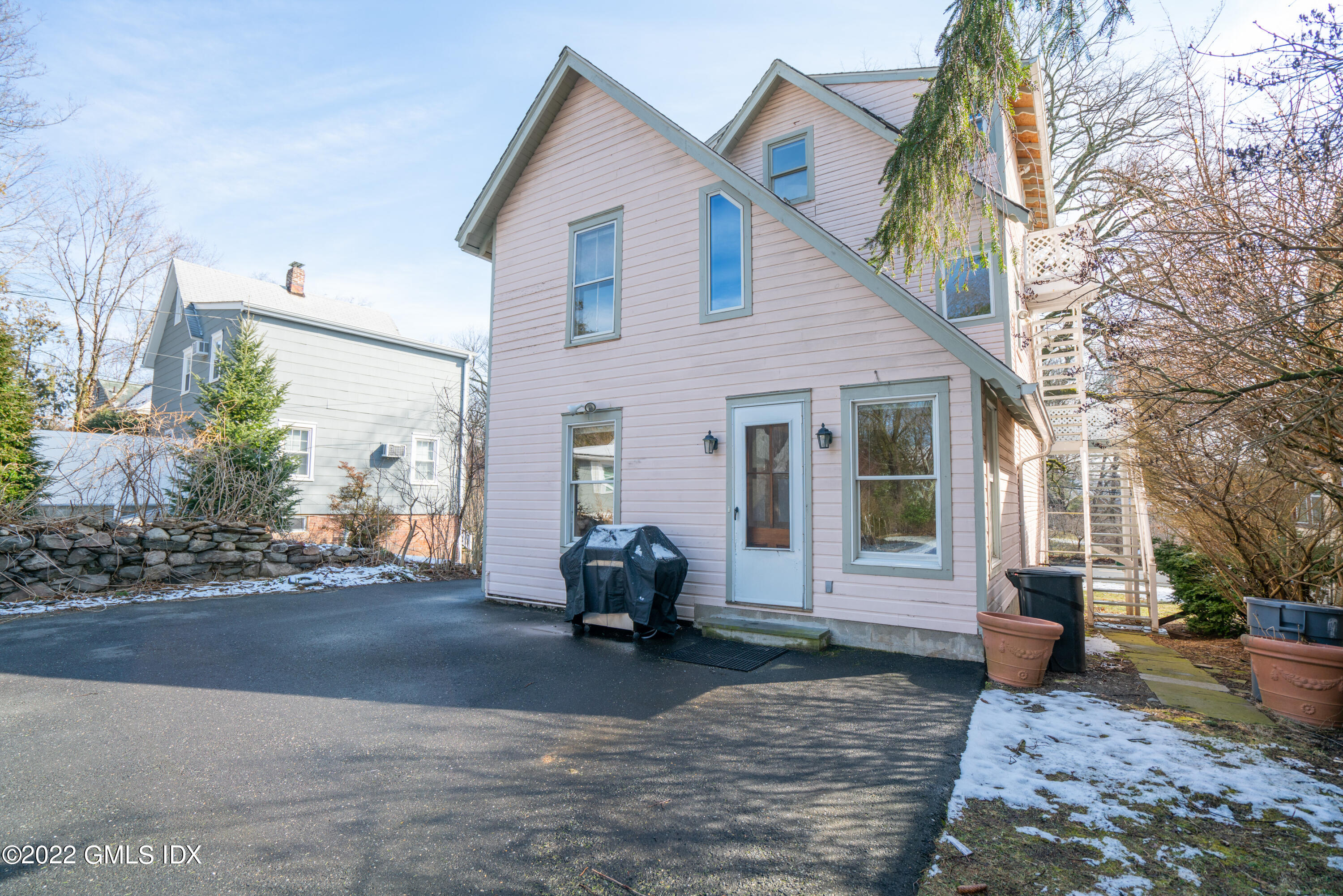 48 Sinawoy Road Cos Cob, CT 06807 - Photo 23 of 25 a view of a house with a patio