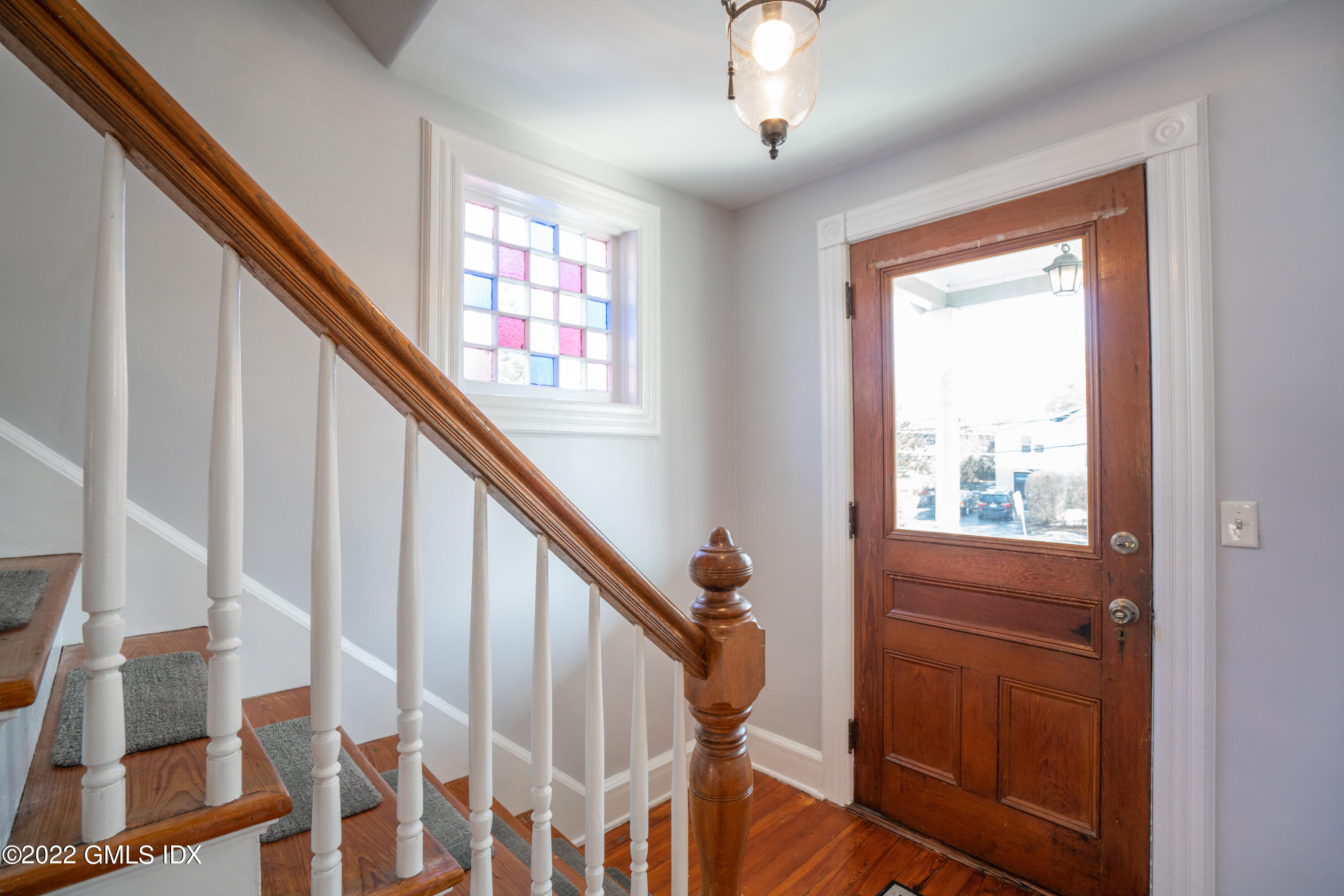 48 Sinawoy Road Cos Cob, CT 06807 - Photo 3 of 25 a view of an entryway with wooden floor and stairs
