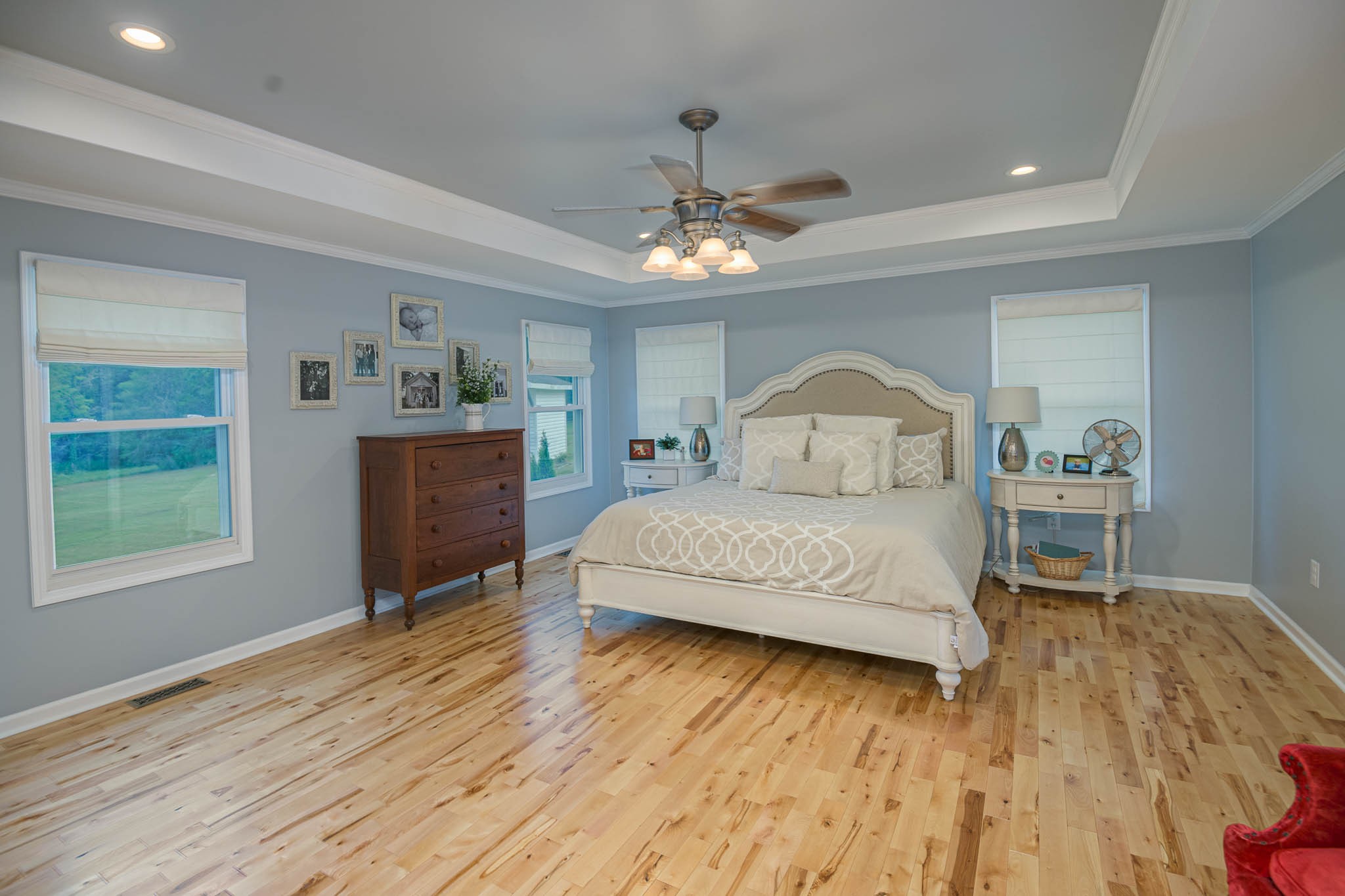 2245 Lower Helton Road Alexandria, TN 37012 - Photo 33 of 43 a spacious bedroom with a large bed and a wooden floor