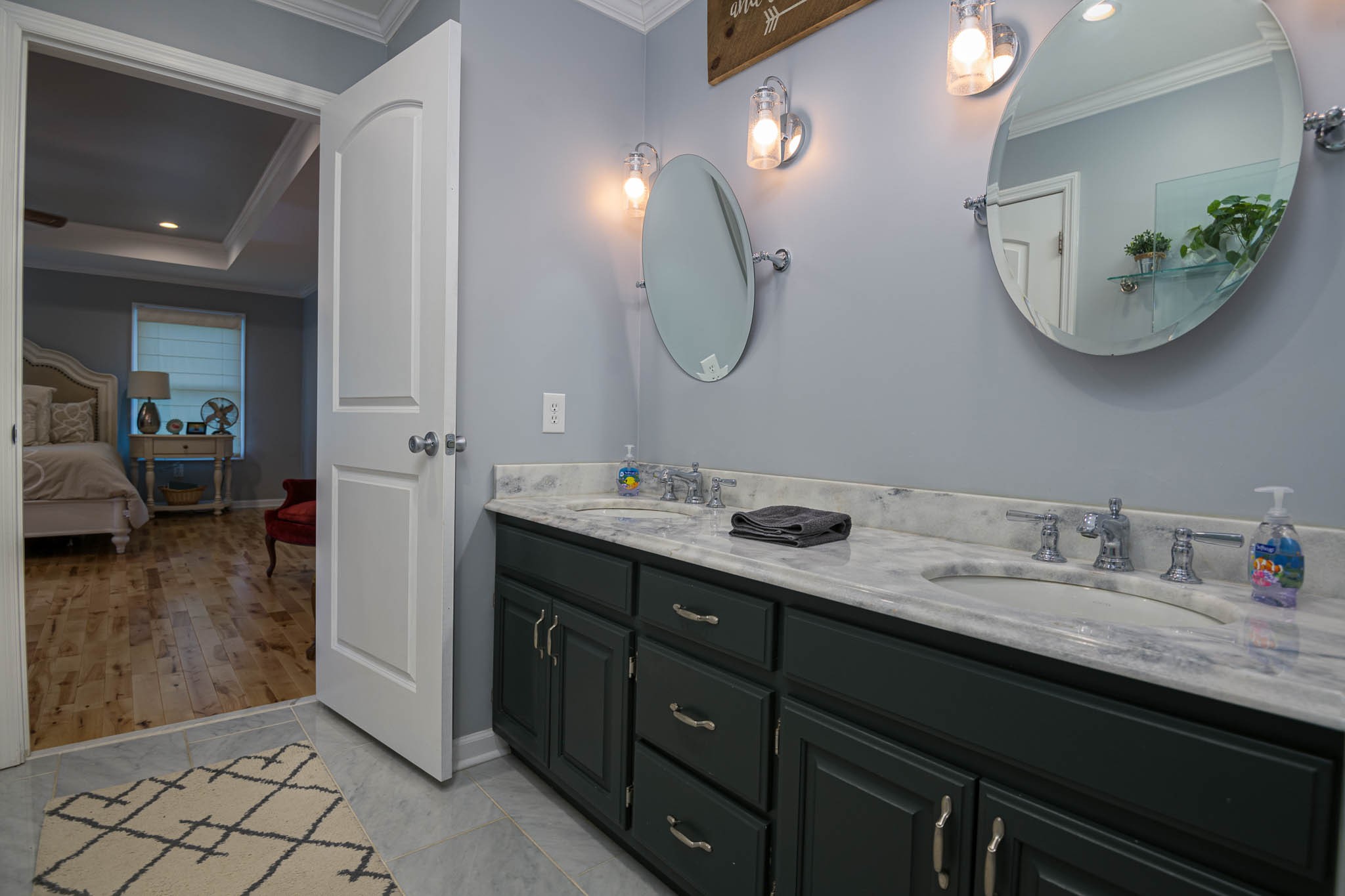 2245 Lower Helton Road Alexandria, TN 37012 - Photo 40 of 43 a en suite bathroom with a double vanity sink and a mirror