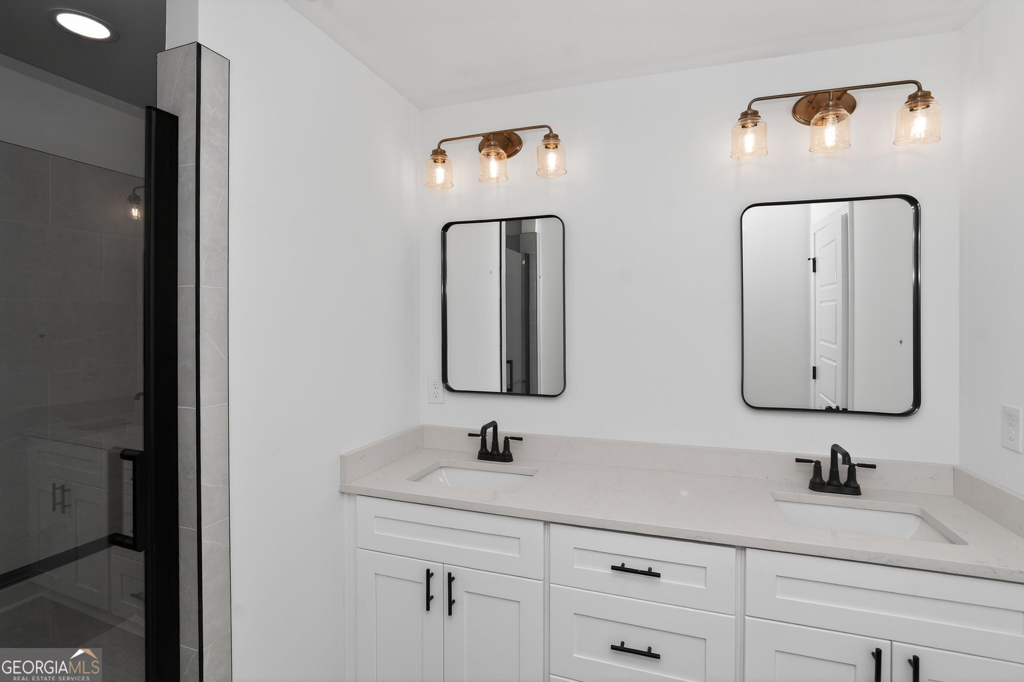 1229 Chappell Mill Road Jackson, GA 30233 - Photo 50 of 55 a bathroom with a double vanity sink and mirror