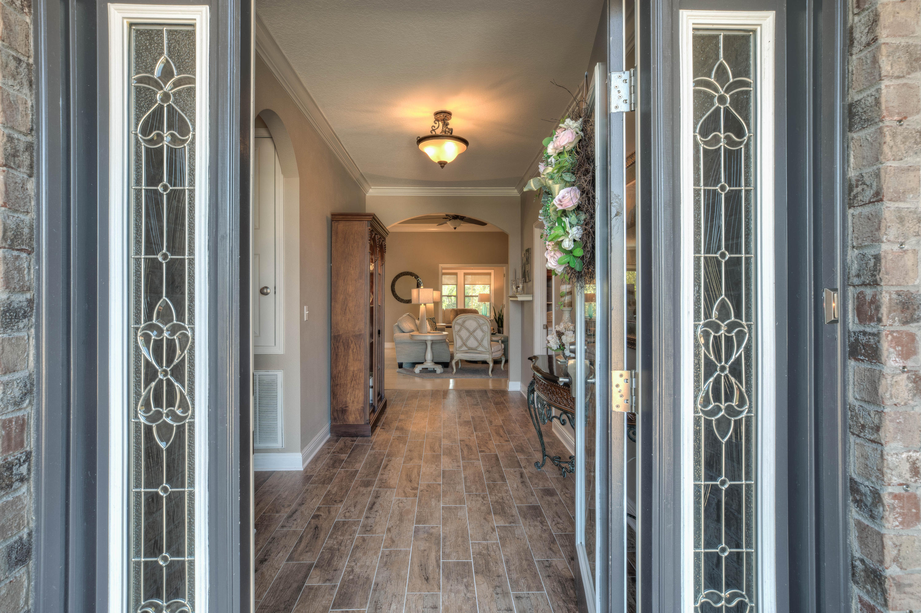 456 Pin Oak Loop Santa Rosa Beach, FL 32459 - Photo 2 of 32 a view of a hallway with a livingroom and furniture