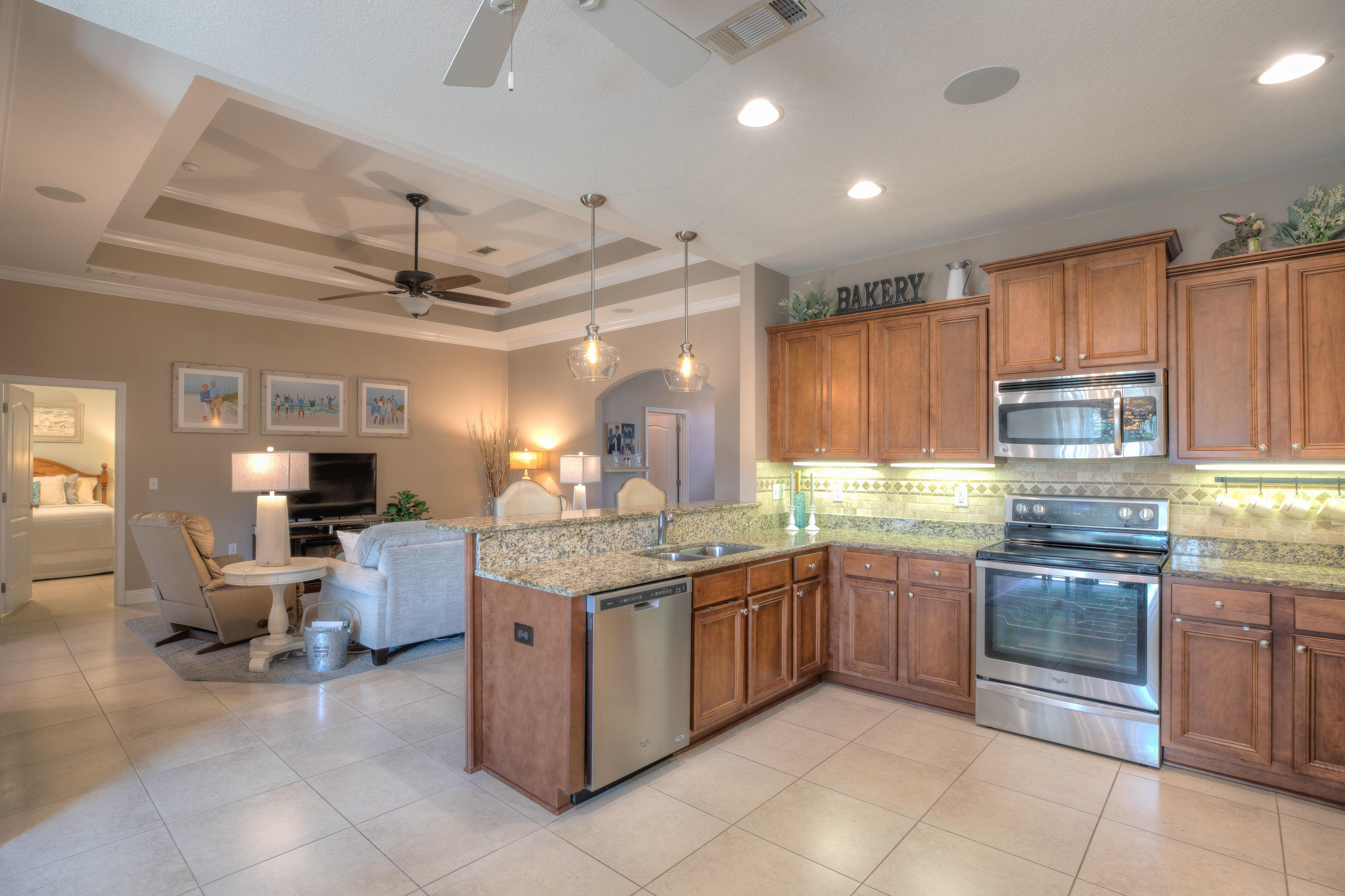 456 Pin Oak Loop Santa Rosa Beach, FL 32459 - Photo 12 of 32 a kitchen with stainless steel appliances granite countertop a sink dishwasher stove and refrigerator