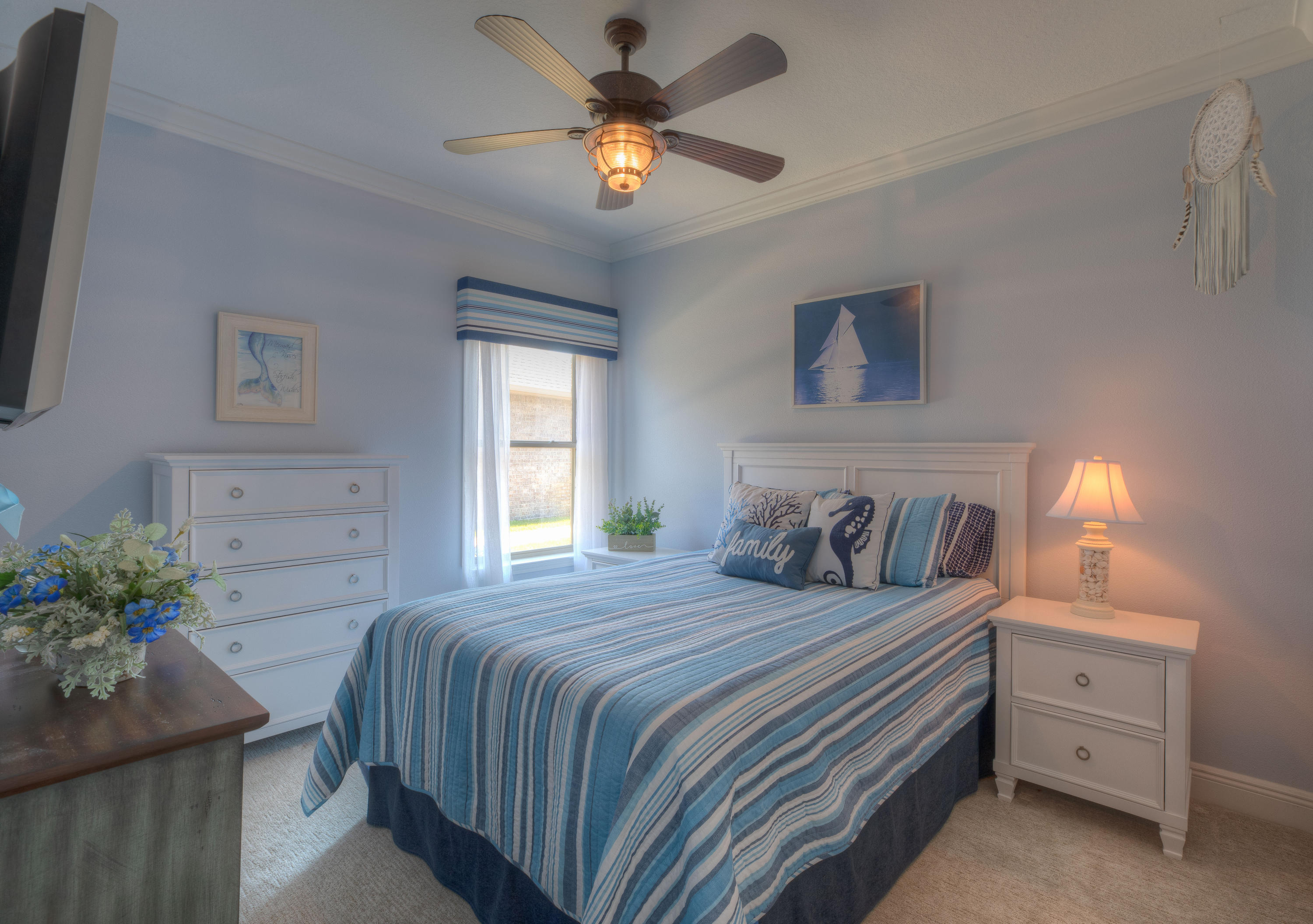 456 Pin Oak Loop Santa Rosa Beach, FL 32459 - Photo 15 of 32 a bedroom with a bed and a potted plant
