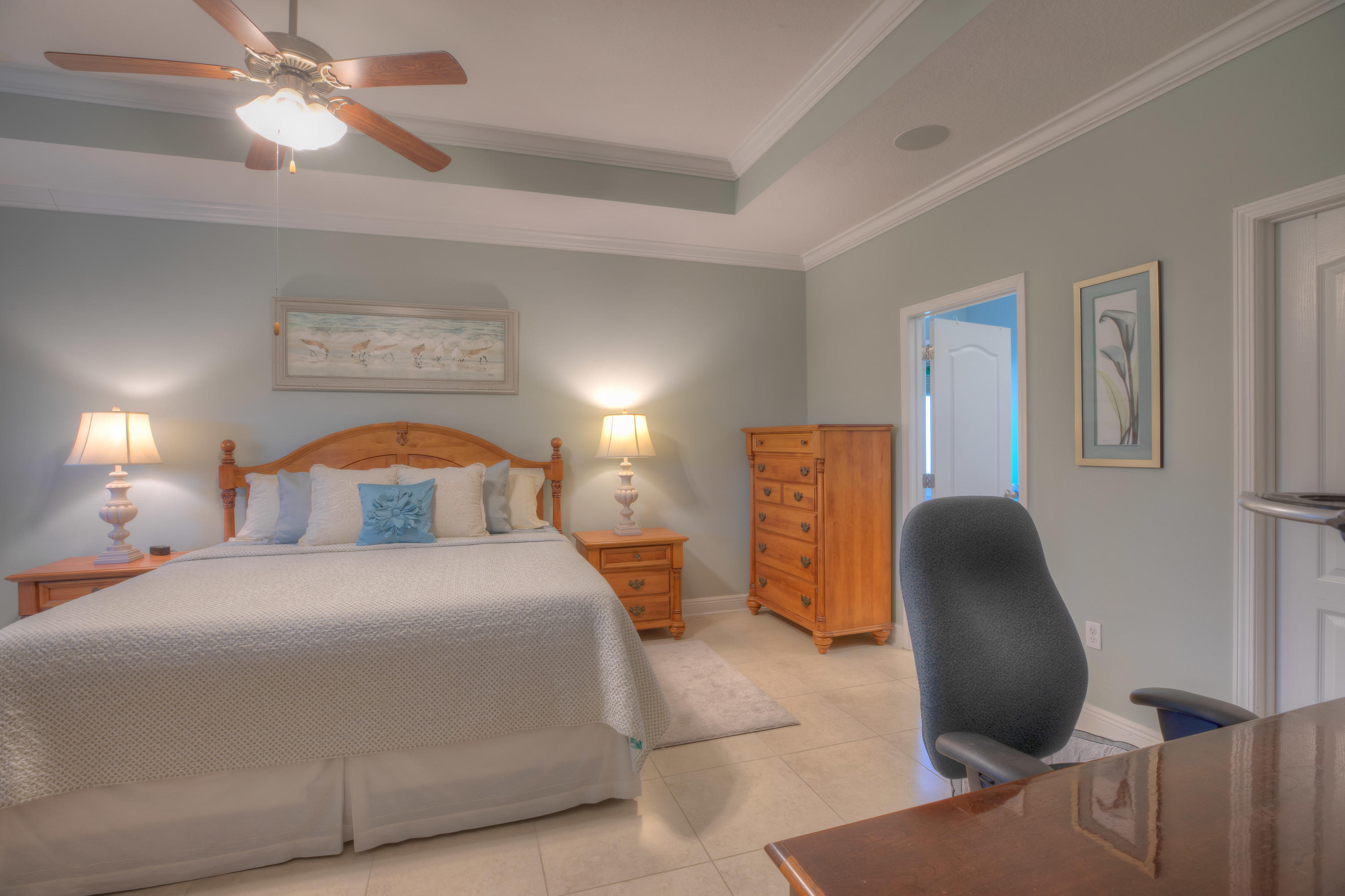 456 Pin Oak Loop Santa Rosa Beach, FL 32459 - Photo 21 of 32 a bedroom with a bed and a chair