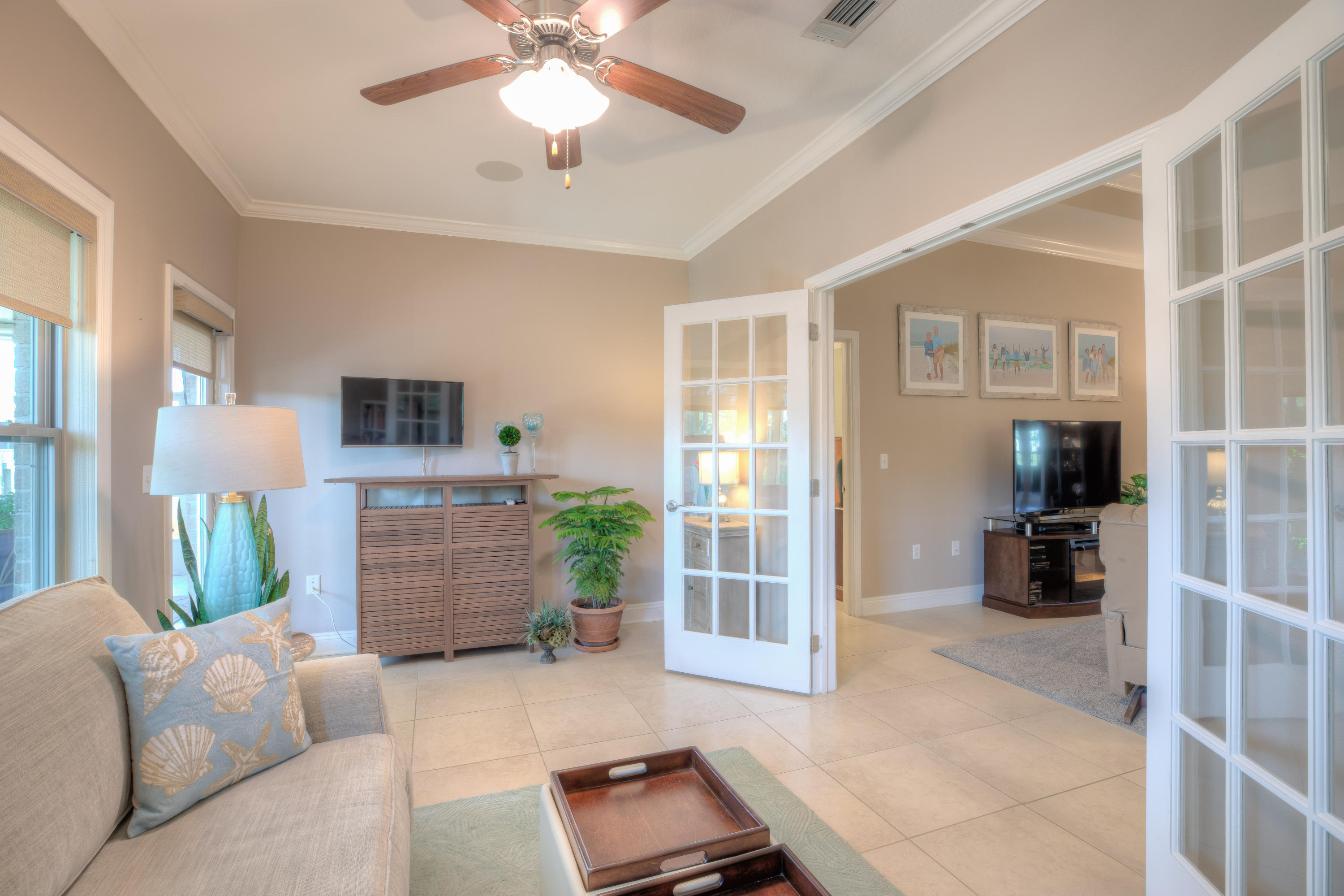 456 Pin Oak Loop Santa Rosa Beach, FL 32459 - Photo 27 of 32 a living room with furniture and a flat screen tv