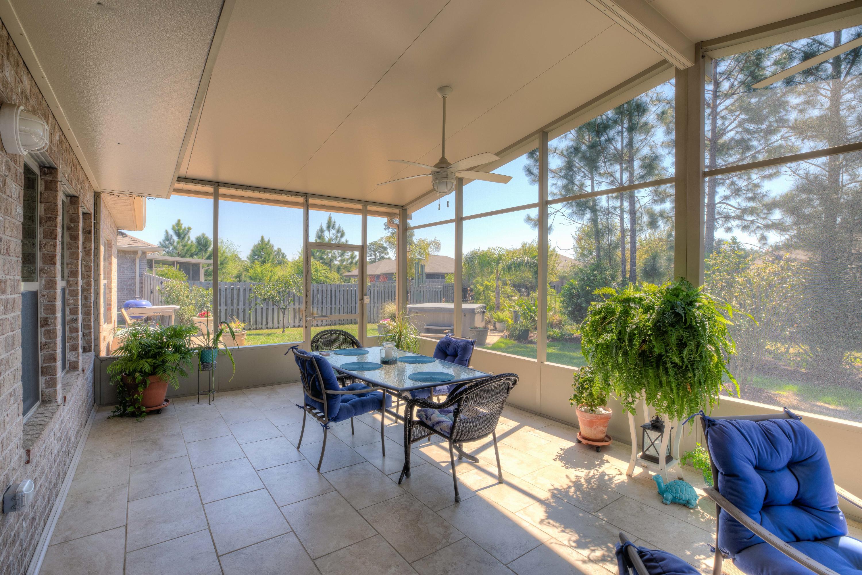 456 Pin Oak Loop Santa Rosa Beach, FL 32459 - Photo 30 of 32 a living room with furniture and a potted plant