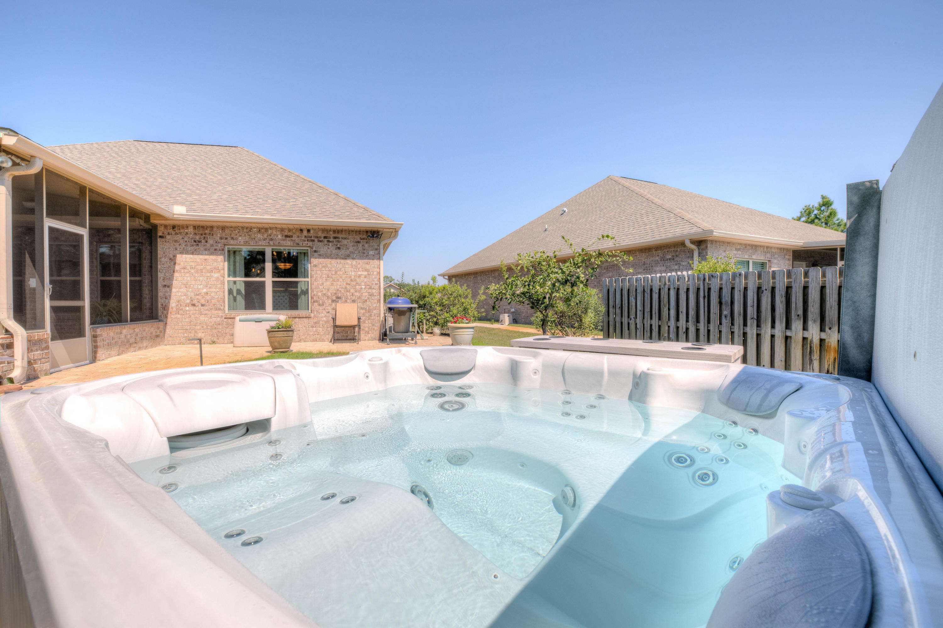 456 Pin Oak Loop Santa Rosa Beach, FL 32459 - Photo 31 of 32 a view of a white house with swimming pool in front of it