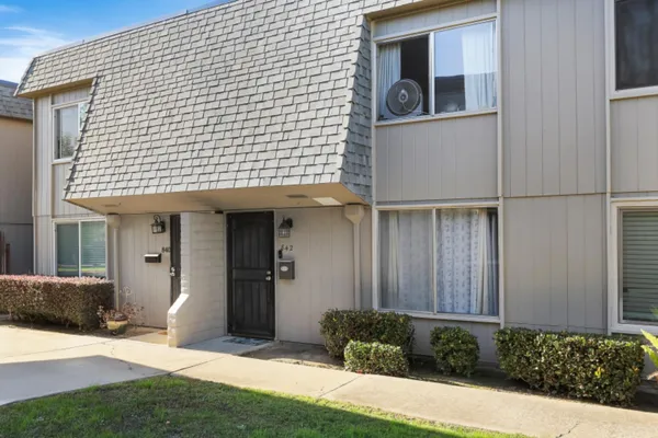a front view of a house with a yard