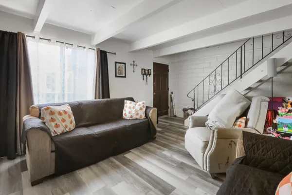 a living room with furniture and a large window