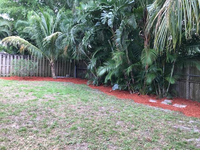 169 Banyan Circle Jupiter, FL 33458 - Photo 6 of 28 169 Banyan Back yard 1