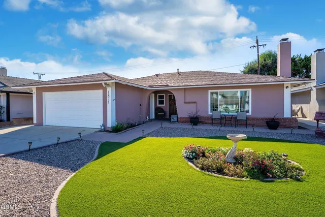 a view of a house with swimming pool and porch