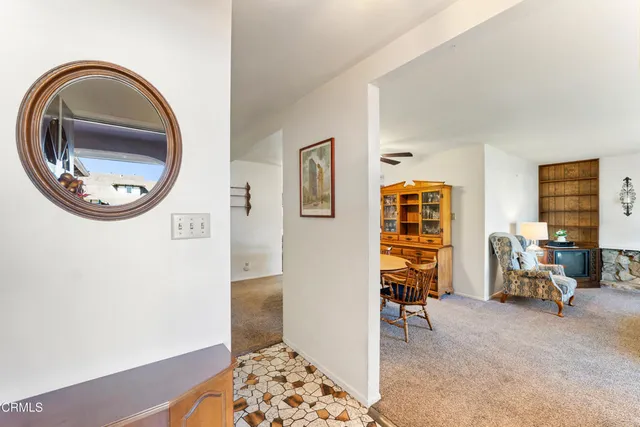 a view of a livingroom with furniture and windows