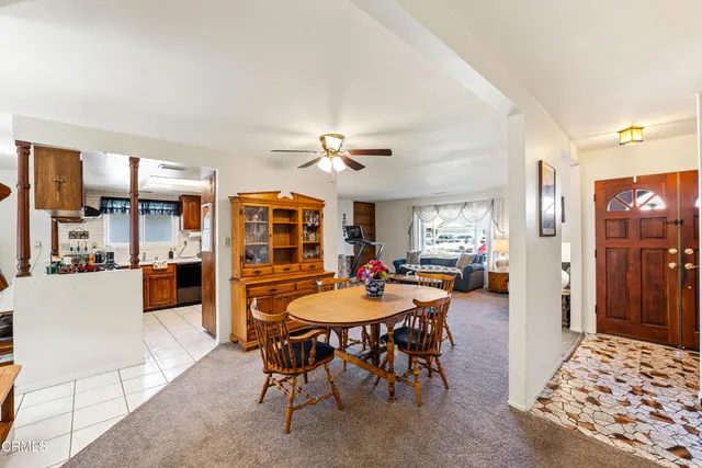 a patio with a table and chairs