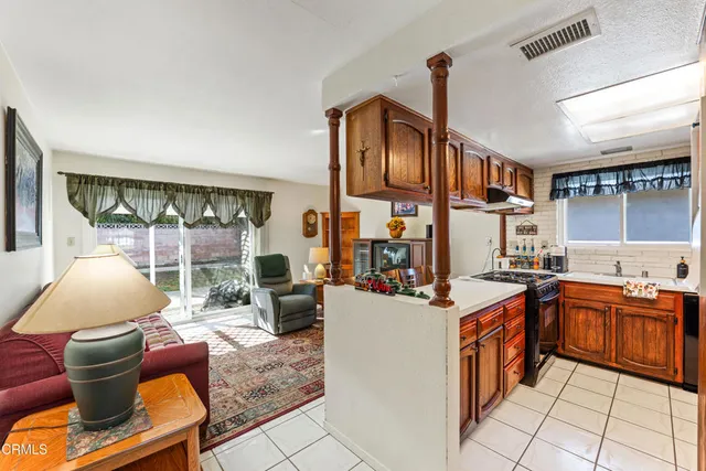 a kitchen with stainless steel appliances granite countertop a sink and cabinets