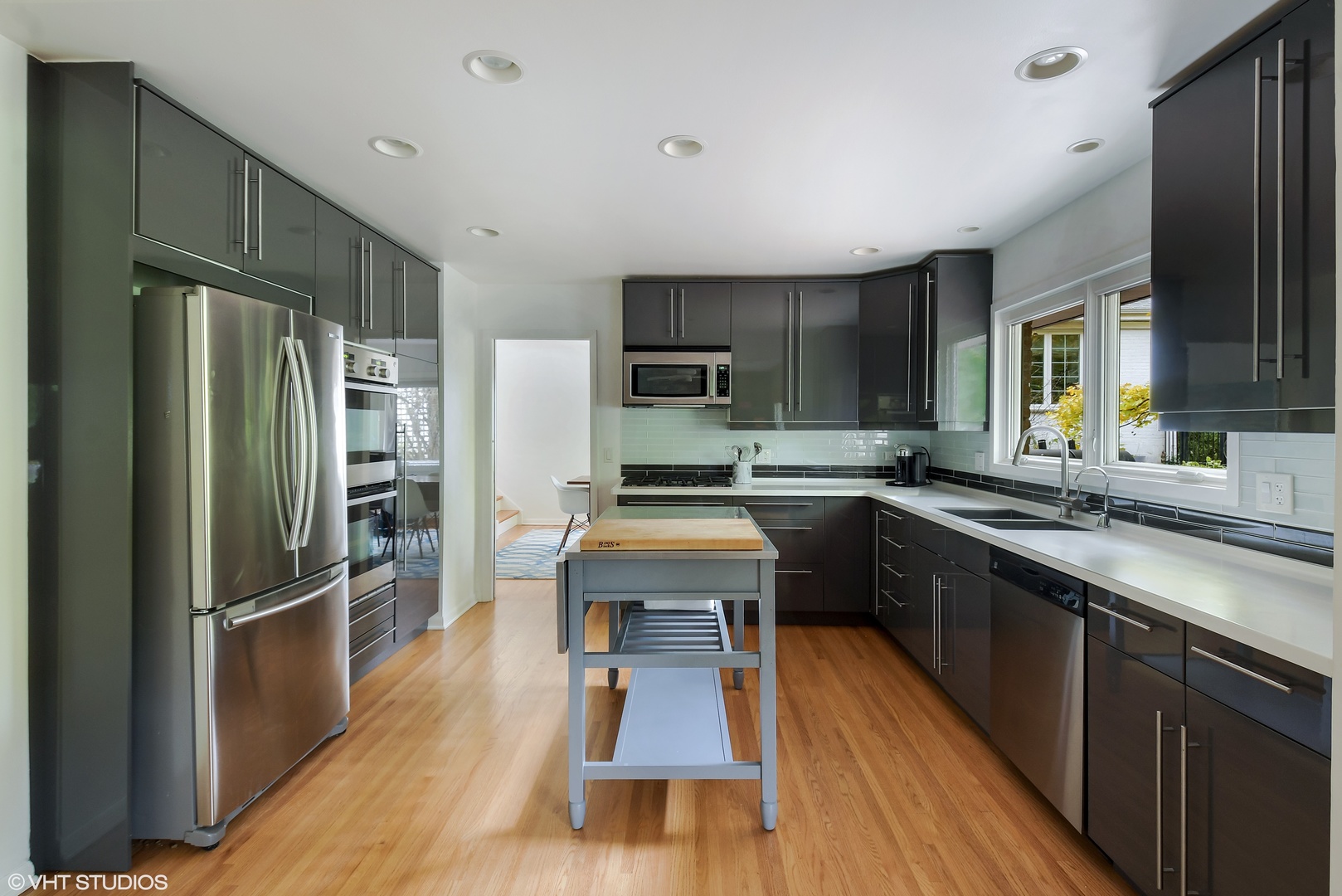 208 Sunset Terrace Lake Bluff, IL 60044 - Photo 7 of 14 a kitchen with stainless steel appliances a refrigerator sink and cabinets