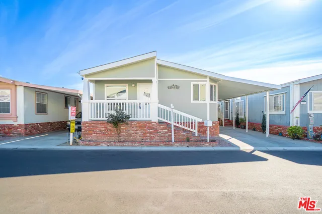 a view of a house with a street