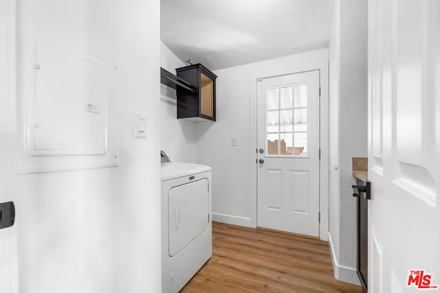 a view of a kitchen from the hallway