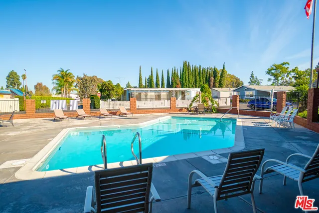 a view of a backyard with sitting area
