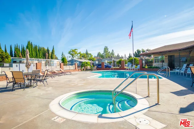 a view of a swimming pool with a patio