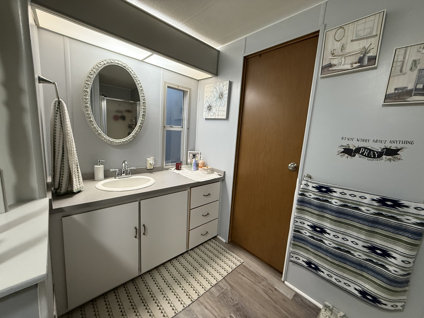 516 Prairie Road Matteson, IL 60443 - Photo 11 of 25 a bathroom with a double vanity sink and a mirror
