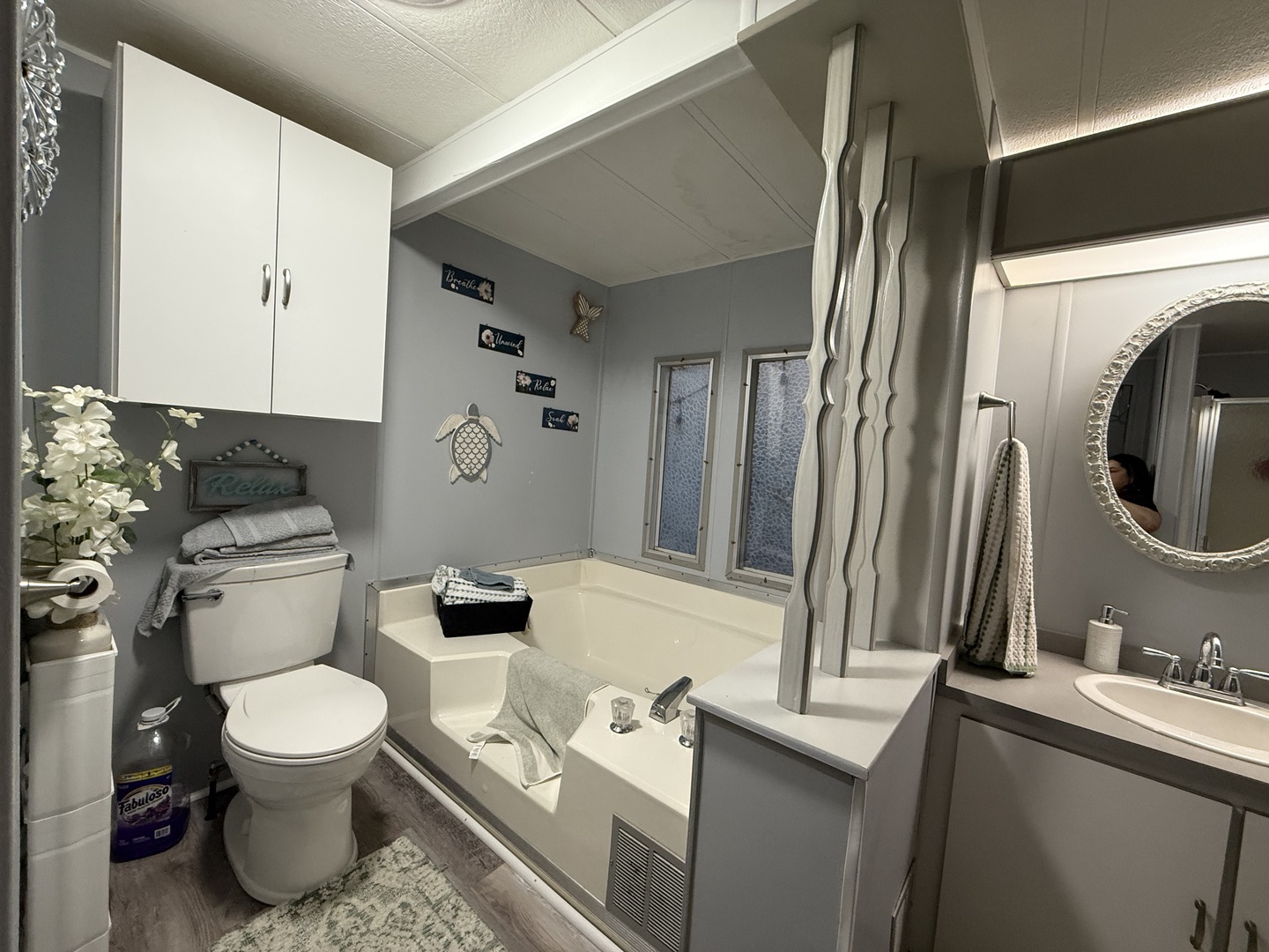 516 Prairie Road Matteson, IL 60443 - Photo 13 of 25 a bathroom with a toilet a sink and a mirror