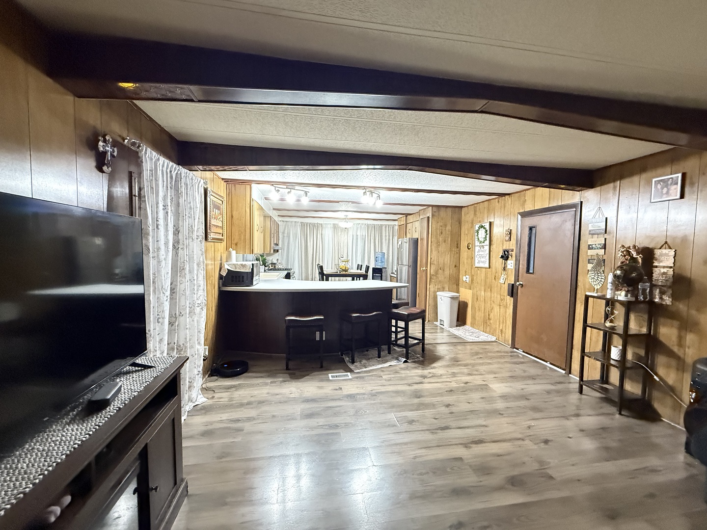 516 Prairie Road Matteson, IL 60443 - Photo 5 of 25 a living room with a flat screen tv and a refrigerator