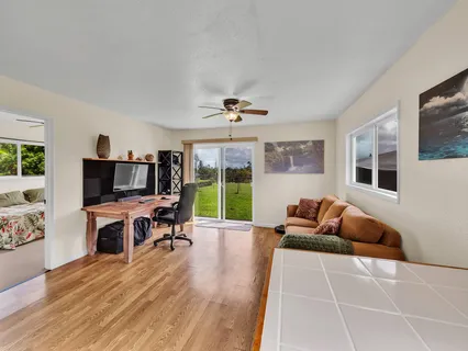 a living room with furniture window and flat screen tv