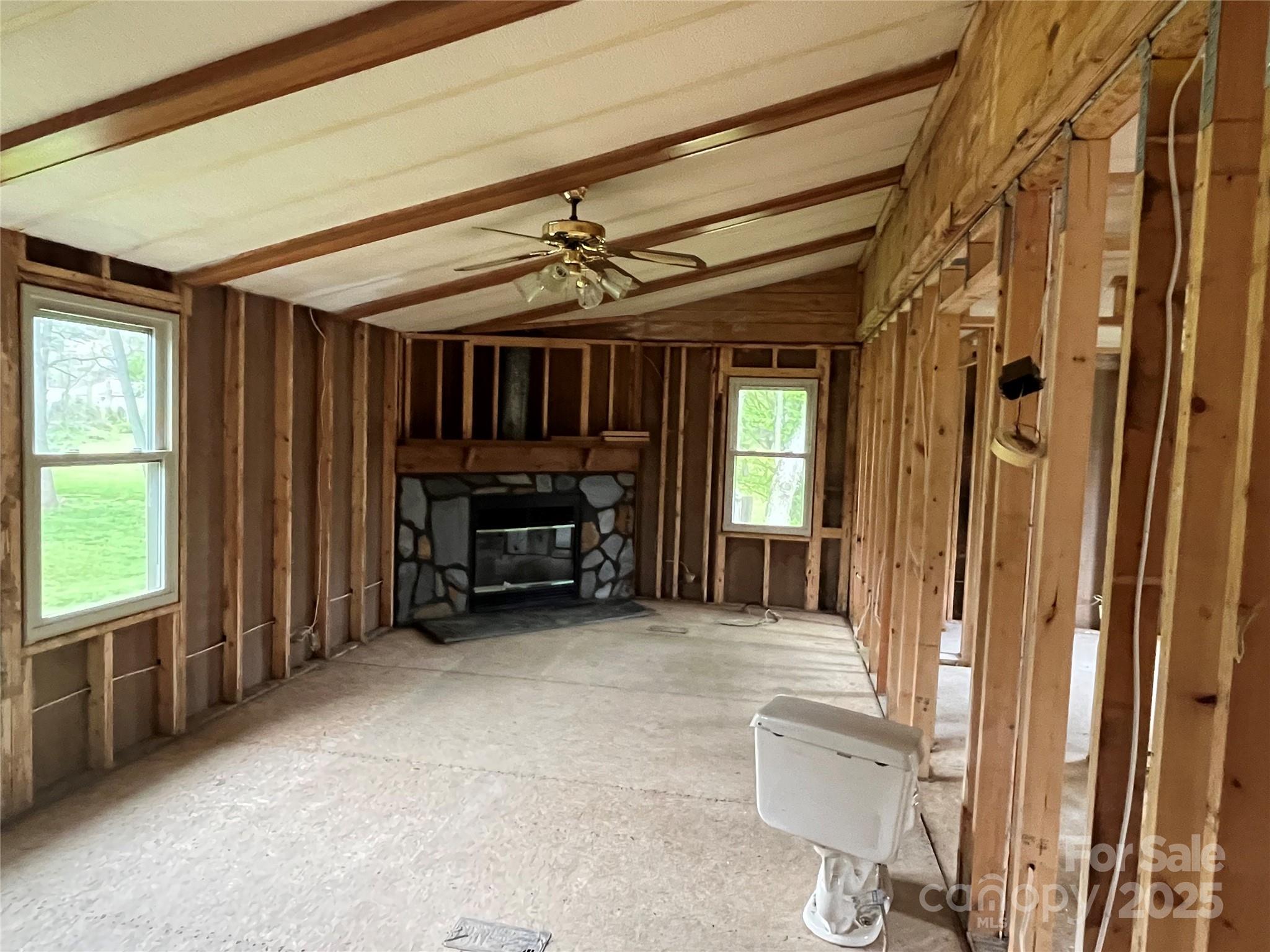 265 Thickety Road Clyde, NC 28721 - Photo 3 of 7 an empty room with furniture and a window