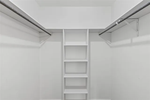 a view of an empty walk in closet