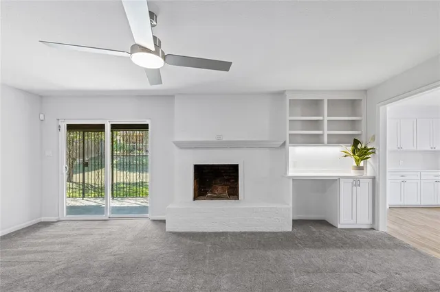 a view of livingroom with furniture and a fireplace