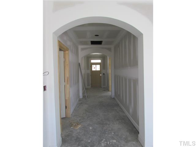 3618 Landshire View Lane Raleigh, NC 27616 - Photo 4 of 5 Gorgeous arched lead from the front door to the living room. 5" hardwoods in the foyer are standard. This picture is of another home with same floorplan.