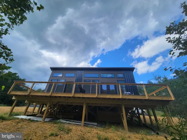 a front view of a house with a roof deck