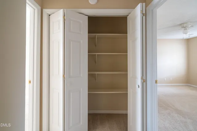 a view of an empty walk in closet