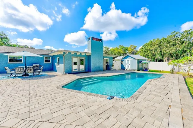 a view of a house with backyard porch and patio