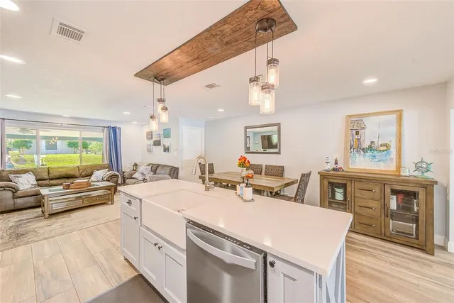 a view of wooden floor and windows in a room