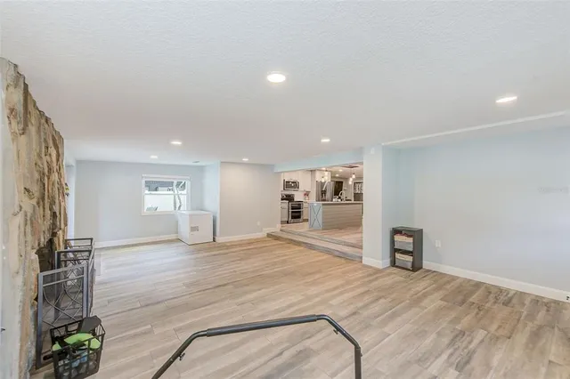 a kitchen with a refrigerator and a stove
