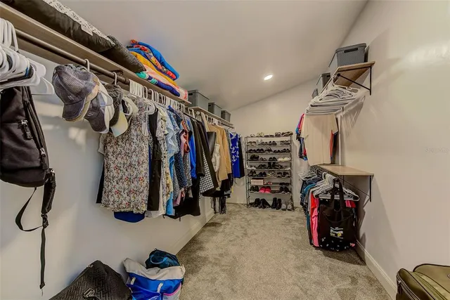 a view of a small house with wooden fence