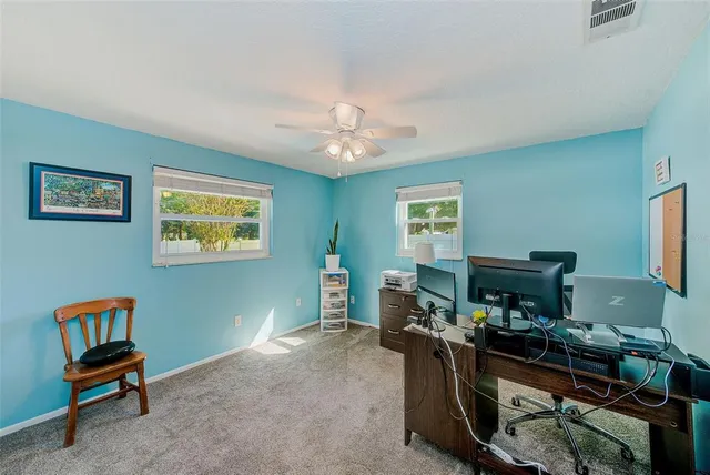 a house with swimming pool in front of it