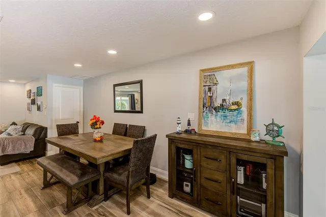a kitchen with refrigerator cabinets and furniture