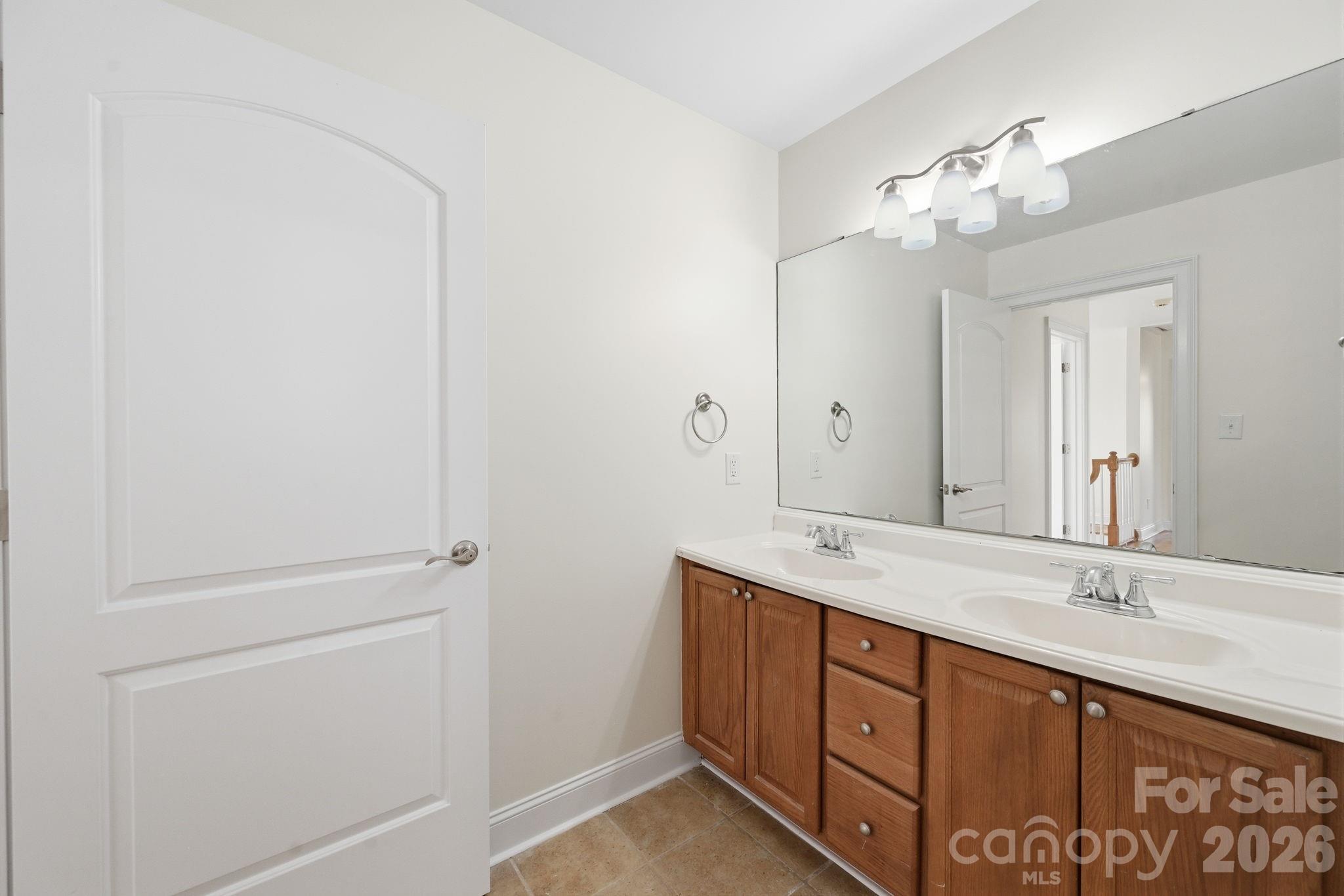 166 Ridge Run Drive Statesville, NC 28625 - Photo 14 of 19 a spacious bathroom with a double vanity sink and mirror