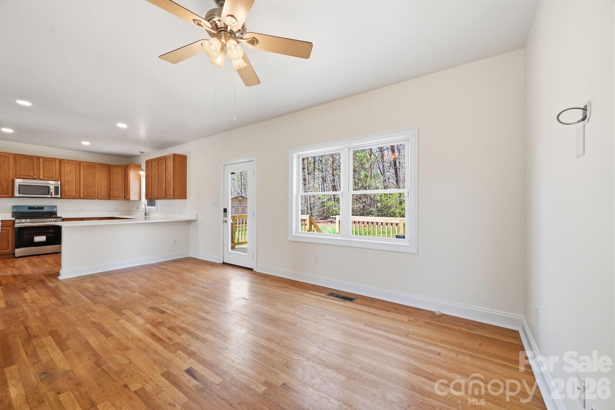166 Ridge Run Drive Statesville, NC 28625 - Photo 6 of 19 a view of a kitchen with microwave and cabinets